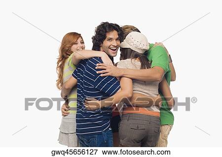 Two men and three young women making a huddle View Large Photo Image Stock Photo - Two men and three young women making a huddle. Fotosearch