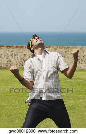 Young man looking excited View Large Photo Image Stock Image - Young man looking excited. Fotosearch