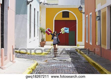 Young woman carrying shopping bags, Old San Juan, San Juan, Puerto Rico View Large Photo Image Stock Image - Young woman carrying shopping bags, Old San Juan, San Juan, Puerto Rico. Fotosearch