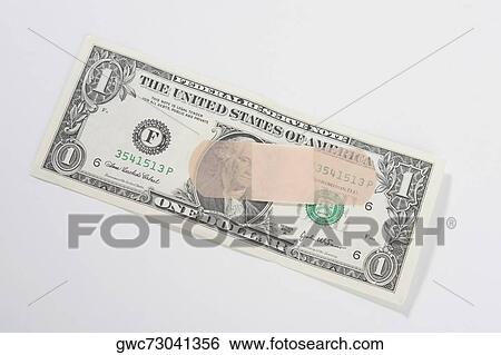 Adhesive bandage on a US dollar bill View Large Photo Image Stock Photograph - Adhesive bandage on a US dollar bill. Fotosearch