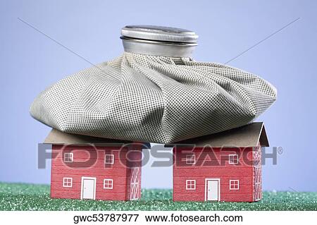Bag of coins on model homes View Large Photo Image Stock Photo - Bag of coins on model homes. Fotosearch