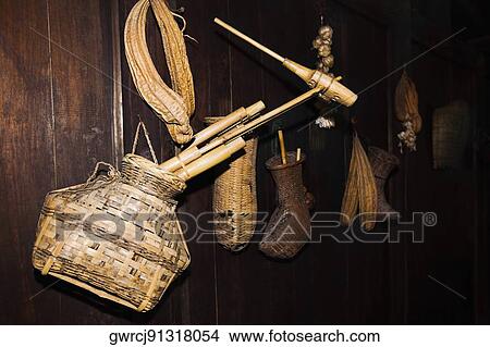 Baskets with sponge gourds hanging on a wooden plank, Yangshuo, Guangxi Province, China View Large Photo Image Picture - Baskets with sponge gourds hanging on a wooden plank, Yangshuo, Guangxi Province, China. Fotosearch