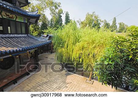 Building in a garden, Yu Yin Shan Fang, Panyu, Guangzhou, Guangdong Province, China View Large Photo Image Stock Photo - Building in a garden, Yu Yin Shan Fang, Panyu, Guangzhou, Guangdong Province, China. Fotosearch