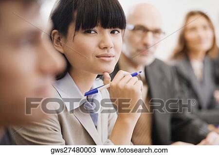 Business executives at a meeting in a board room View Large Photo Image Stock Image - Business executives at a meeting in a board room. Fotosearch