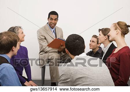 Picture - Business executives at a meeting in an office. Fotosearch