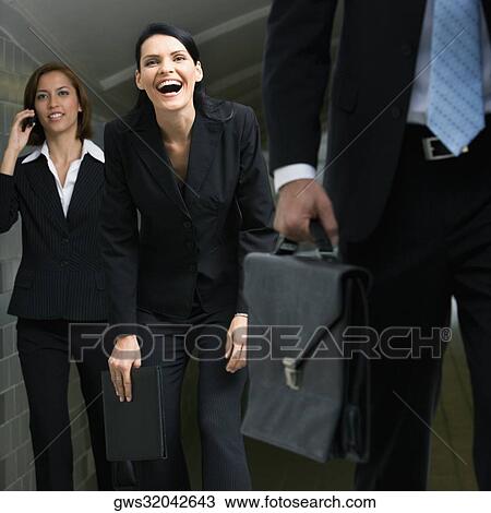 Business executives walking in a subway View Large Photo Image Stock Image - Business executives walking in a subway. Fotosearch