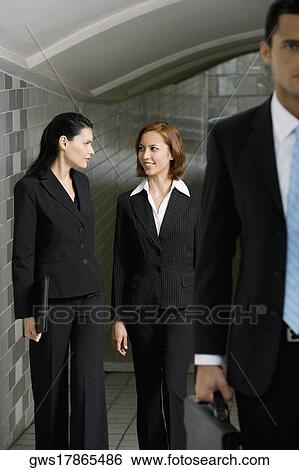 Business executives walking in a subway View Large Photo Image Stock Photograph - Business executives walking in a subway. Fotosearch
