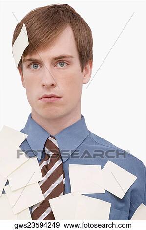 Close-up of a businessman covered with adhesive notes and thinking View Large Photo Image Stock Photo - Close-up of a businessman covered with adhesive notes and thinking. Fotosearch