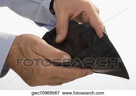 Close-up of a businessman's hands showing his empty wallet View Large Photo Image Stock Photo - Close-up of a businessman's hands showing his empty wallet. Fotosearch