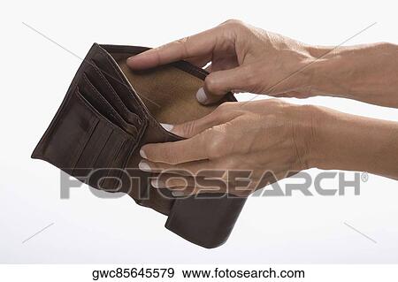 Close-up of a businessman's hands showing his empty wallet View Large Photo Image Stock Photo - Close-up of a businessman's hands showing his empty wallet. Fotosearch