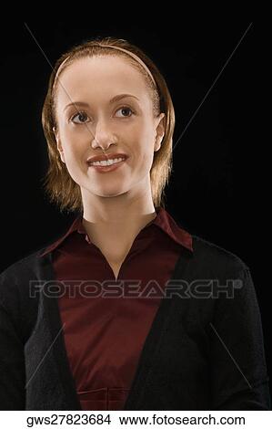 Close-up of a businesswoman day dreaming View Large Photo Image Picture - Close-up of a businesswoman day dreaming. Fotosearch
