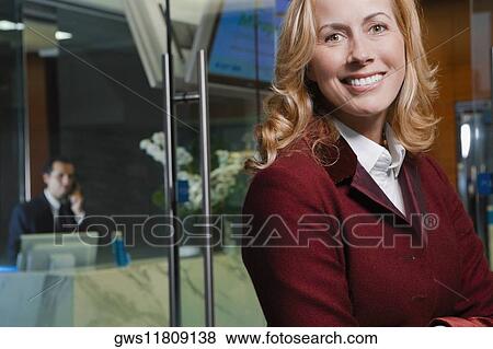 Stock Photo - Close-up of a businesswoman smiling. Fotosearch