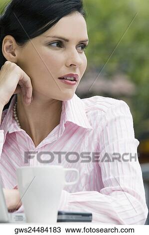 Close-up of a businesswoman thinking View Large Photo Image Stock Image - Close-up of a businesswoman thinking. Fotosearch