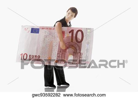 Stock Image - Close-up of a figurine carrying a ten euro banknote. Fotosearch