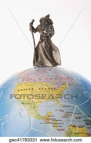 Close-up of a figurine of a fortune teller on a globe View Large Photo Image Stock Image - Close-up of a figurine of a fortune teller on a globe. Fotosearch