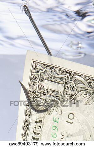Close-up of a fishing hook through one dollar bill in water View Large Photo Image Stock Photo - Close-up of a fishing hook through one dollar bill in water. Fotosearch