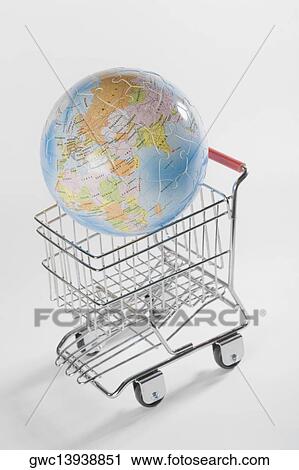 Close-up of a globe in a shopping cart View Large Photo Image Stock Image - Close-up of a globe in a shopping cart. Fotosearch