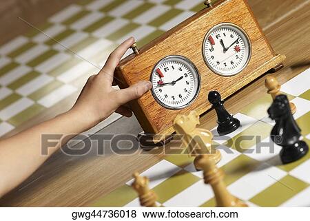 Close-up of a human hand pushing button of a chess clock View Large Photo Image Stock Photo - Close-up of a human hand pushing button of a chess clock. Fotosearch
