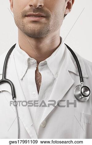 Stock Photo - Close-up of a male doctor with a stethoscope around his neck. Fotosearch
