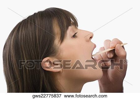 Close-up of a mature woman having a throat examination View Large Photo Image Stock Photo - Close-up of a mature woman having a throat examination. Fotosearch