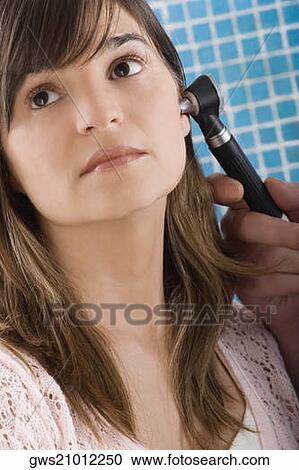 Close-up of a mature woman having her ear examined View Large Photo Image Stock Image - Close-up of a mature woman having her ear examined. Fotosearch