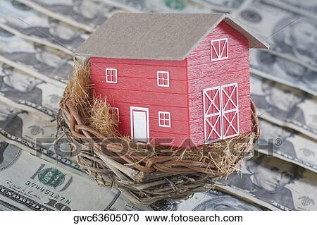 Stock Image - Close-up of a model home in a bird's nest. Fotosearch