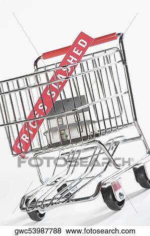 Close-up of a model home in a shopping cart View Large Photo Image Stock Photo - Close-up of a model home in a shopping cart. Fotosearch