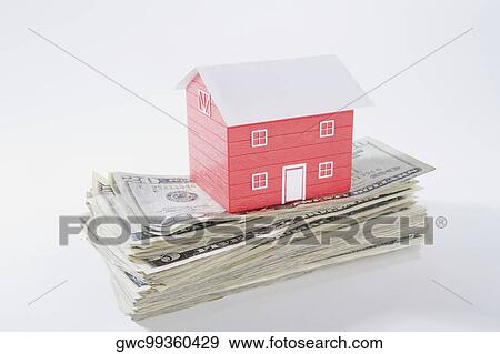 Close-up of a model home on the top of US paper currency View Large Photo Image Stock Photo - Close-up of a model home on the top of US paper currency. Fotosearch