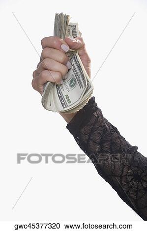 Close-up of a person's hand holding US dollar bills View Large Photo Image Stock Image - Close-up of a person's hand holding US dollar bills. Fotosearch