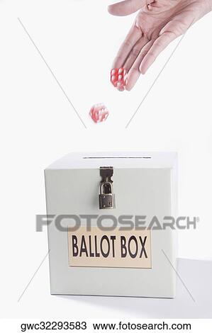 Close-up of a person's hand throwing dices on a ballot box View Large Photo Image Stock Image - Close-up of a person's hand throwing dices on a ballot box. Fotosearch