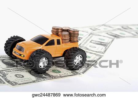 Close-up of a pick-up truck on a road made of US dollar bills View Large Photo Image Stock Photo - Close-up of a pick-up truck on a road made of US dollar bills. Fotosearch