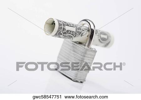 Stock Image - Close-up of a rolled bank note with a padlock. Fotosearch