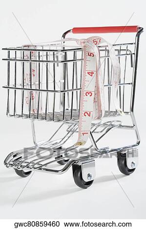 Close-up of a tape measure in a shopping cart View Large Photo Image Stock Image - Close-up of a tape measure in a shopping cart. Fotosearch