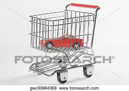Close-up of a toy car in a shopping cart View Large Photo Image Stock Photo - Close-up of a toy car in a shopping cart. Fotosearch