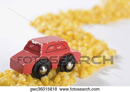 Close-up of a toy car on a road made up of corns View Large Photo Image Stock Photo - Close-up of a toy car on a road made up of corns. Fotosearch