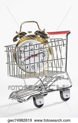Close-up of an alarm clock in a shopping cart View Large Photo Image Stock Photo - Close-up of an alarm clock in a shopping cart. Fotosearch