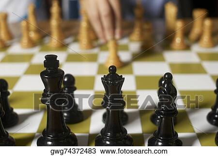 Close-up of chess pieces on a chessboard View Large Photo Image Stock Image - Close-up of chess pieces on a chessboard. Fotosearch