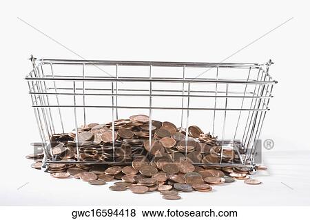 Close-up of coins in a metal basket View Large Photo Image Stock Photo - Close-up of coins in a metal basket. Fotosearch