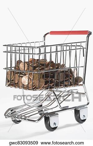 Close-up of coins in a shopping cart View Large Photo Image Stock Photo - Close-up of coins in a shopping cart. Fotosearch