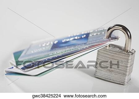 Picture - Close-up of credit cards with a padlock. Fotosearch