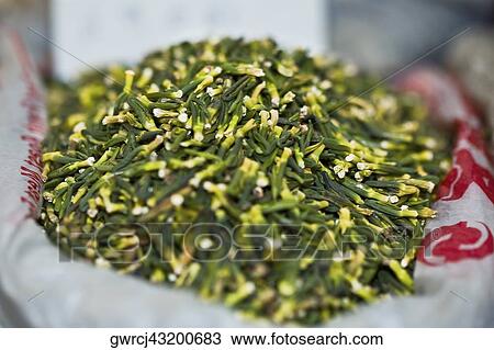 Stock Image - Close-up of dry lotus seeds at a market stall, Tai'an, Shandong Province, China. Fotosearch