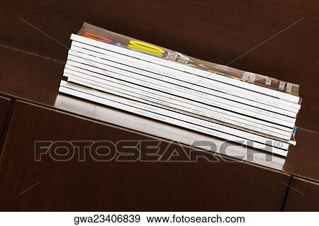 Close-up of magazines on a table View Large Photo Image Stock Photo - Close-up of magazines on a table. Fotosearch