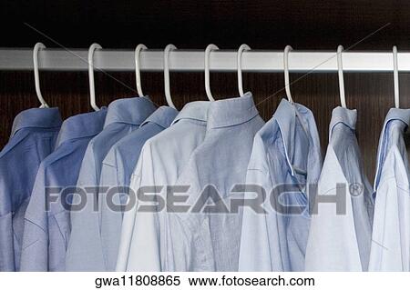 Stock Photography - Close-up of shirts on a hanger. Fotosearch