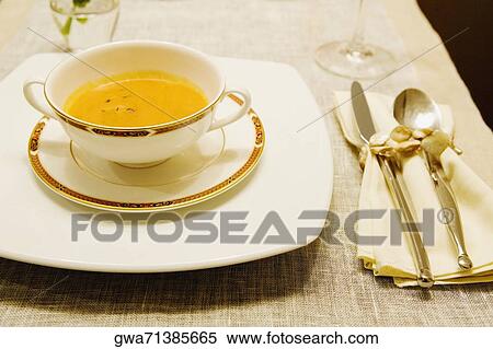 Stock Photography - Close-up of soup in a bowl on a dining table. Fotosearch