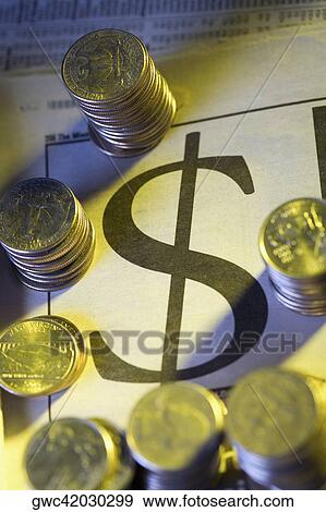 Close-up of stack of coins on a financial newspaper View Large Photo Image Stock Photo - Close-up of stack of coins on a financial newspaper. Fotosearch