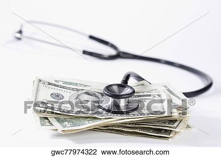 Close-up of stethoscope on US dollar bills View Large Photo Image Stock Image - Close-up of stethoscope on US dollar bills. Fotosearch