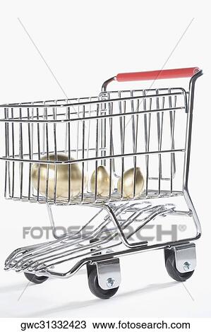 Close-up of three golden eggs in a shopping cart View Large Photo Image Stock Image - Close-up of three golden eggs in a shopping cart. Fotosearch