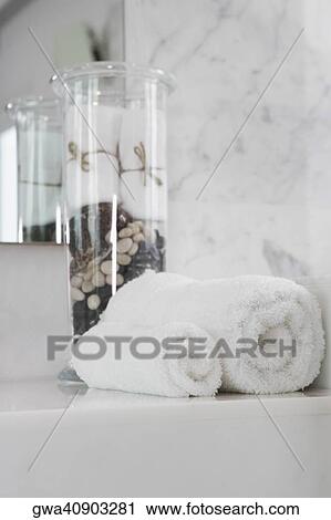 Close-up of towels on a bathtub View Large Photo Image Stock Image - Close-up of towels on a bathtub. Fotosearch