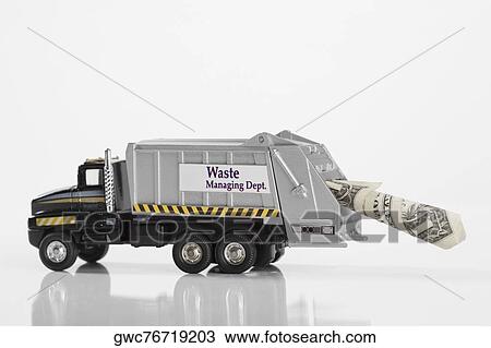 Close-up of toy garbage truck carrying US dollar bill View Large Photo Image Stock Image - Close-up of toy garbage truck carrying US dollar bill. Fotosearch