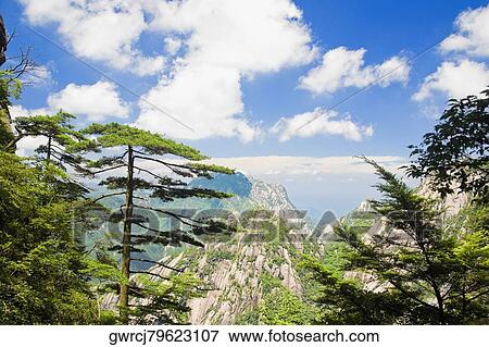 Clouds over a mountain range, Huangshan, Anhui province, China View Large Photo Image Stock Photo - Clouds over a mountain range, Huangshan, Anhui province, China. Fotosearch